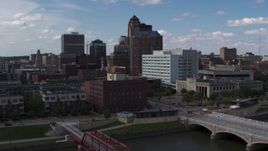 5.7K aerial stock footage descend toward river with view of government offices and skyline, Downtown Des Moines, Iowa Aerial Stock Footage | DX0002_165_017