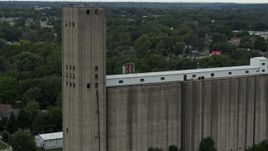 5.7K aerial stock footage of approaching a grain elevator in Des Moines, Iowa Aerial Stock Footage | DX0002_166_026