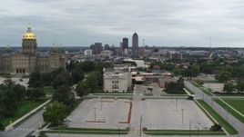 5.7K aerial stock footage reverse view of distant skyline seen from the state library and capitol, Downtown Des Moines, Iowa Aerial Stock Footage | DX0002_166_034