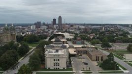 5.7K aerial stock footage of the distant skyline seen while descending by state library building, Des Moines, Iowa Aerial Stock Footage | DX0002_166_041