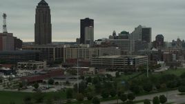 5.7K aerial stock footage of office buildings around the skyscraper in Downtown Des Moines, Iowa during descent Aerial Stock Footage | DX0002_167_023