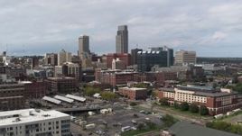5.7K aerial stock footage of a reverse view of the city's skyline in Downtown Omaha, Nebraska Aerial Stock Footage | DX0002_168_002