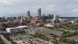 5.7K aerial stock footage of flying by the city's skyline in Downtown Omaha, Nebraska Aerial Stock Footage | DX0002_168_004
