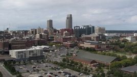 5.7K aerial stock footage of passing by the city's skyline in Downtown Omaha, Nebraska Aerial Stock Footage | DX0002_168_005