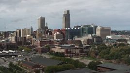 5.7K aerial stock footage of a towering skyscraper and downtown skyline in Downtown Omaha, Nebraska Aerial Stock Footage | DX0002_168_011