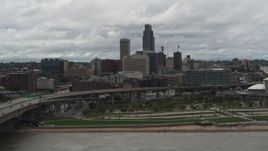 5.7K aerial stock footage of the city skyline and park across the river, Downtown Omaha, Nebraska Aerial Stock Footage | DX0002_168_017