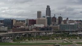 5.7K aerial stock footage of the city skyline seen from riverfront park, Downtown Omaha, Nebraska Aerial Stock Footage | DX0002_169_001