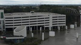 5.7K aerial stock footage of orbiting a flooded parking garage in Council Bluffs, Iowa Aerial Stock Footage | DX0002_169_012