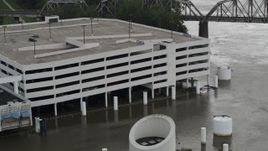 5.7K aerial stock footage of circling a flooded parking garage in Council Bluffs, Iowa Aerial Stock Footage | DX0002_169_015