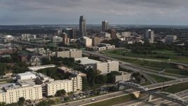 5.7K aerial stock footage of the city's skyline seen from university and apartment complex, Downtown Omaha, Nebraska Aerial Stock Footage | DX0002_170_010