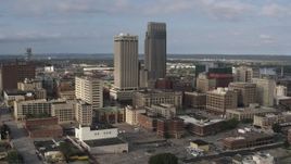 5.7K aerial stock footage of flying by skyscrapers towering over city buildings in Downtown Omaha, Nebraska Aerial Stock Footage | DX0002_170_022