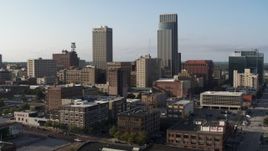 5.7K aerial stock footage ascend with view of the city's skyscrapers in Downtown Omaha, Nebraska Aerial Stock Footage | DX0002_170_037