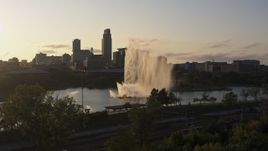 5.7K aerial stock footage stationary view of a fountain with view of skyline at sunset, Downtown Omaha, Nebraska Aerial Stock Footage | DX0002_172_007