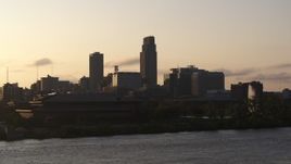 5.7K aerial stock footage the skyline at sunset, seen from the river, Downtown Omaha, Nebraska Aerial Stock Footage | DX0002_172_011