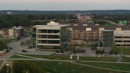 5.7K aerial stock footage orbit a modern office building at sunset in Council Bluffs, Iowa Aerial Stock Footage | DX0002_172_036