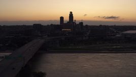 5.7K aerial stock footage approach skyline from bridge over the river at twilight, Downtown Omaha, Nebraska Aerial Stock Footage | DX0002_172_037