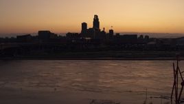 5.7K aerial stock footage of ascending toward the skyline from the river at twilight, Downtown Omaha, Nebraska Aerial Stock Footage | DX0002_172_045