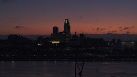 5.7K aerial stock footage of ascending over the river toward the skyline at twilight, Downtown Omaha, Nebraska Aerial Stock Footage | DX0002_173_001