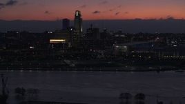 5.7K aerial stock footage of flying by skyscrapers in the skyline at twilight, Downtown Omaha, Nebraska Aerial Stock Footage | DX0002_173_004