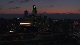 5.7K aerial stock footage of ascending toward the city's skyline at twilight, Downtown Omaha, Nebraska Aerial Stock Footage | DX0002_173_007