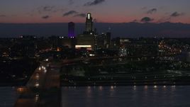 5.7K aerial stock footage of a view of the city's skyline at twilight, seen from the river, Downtown Omaha, Nebraska Aerial Stock Footage | DX0002_173_010