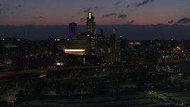 5.7K aerial stock footage flyby the city's skyline at twilight, Downtown Omaha, Nebraska Aerial Stock Footage | DX0002_173_011
