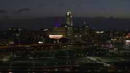 5.7K aerial stock footage of ascending past the city's skyline at twilight, Downtown Omaha, Nebraska Aerial Stock Footage | DX0002_173_016