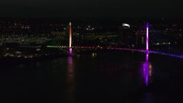 5.7K aerial stock footage of approaching a pedestrian bridge spanning the Missouri River at night, Omaha, Nebraska Aerial Stock Footage | DX0002_173_020