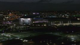 5.7K aerial stock footage orbit and approach arena and convention center complex at night, Downtown Omaha, Nebraska Aerial Stock Footage | DX0002_173_024