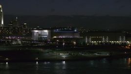 5.7K aerial stock footage approach arena and convention center complex from river at night, Downtown Omaha, Nebraska Aerial Stock Footage | DX0002_173_029