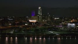 5.7K aerial stock footage of the city's skyline at night, seen from river, Downtown Omaha, Nebraska Aerial Stock Footage | DX0002_173_032
