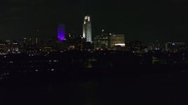 5.7K aerial stock footage of tall skyscrapers at night, Downtown Omaha, Nebraska Aerial Stock Footage | DX0002_173_042