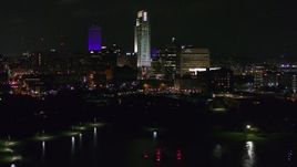 5.7K aerial stock footage of slowly ascending toward tall skyscrapers at night, Downtown Omaha, Nebraska Aerial Stock Footage | DX0002_173_048
