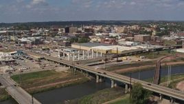 5.7K aerial stock footage of flying by bridges and riverfront warehouses near downtown, Sioux City, Iowa Aerial Stock Footage | DX0002_174_002