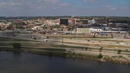 5.7K aerial stock footage of flying by I-29 with a view of Downtown Sioux City, Iowa Aerial Stock Footage | DX0002_174_016