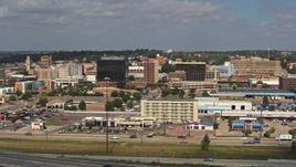 5.7K aerial stock footage fly away from and by office buildings in Downtown Sioux City, Iowa Aerial Stock Footage | DX0002_174_025