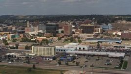 5.7K aerial stock footage of office buildings in Downtown Sioux City, Iowa, descend near highway Aerial Stock Footage | DX0002_174_036