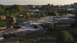 5.7K aerial stock footage of orbiting waterfalls at sunset in Sioux Falls, South Dakota Aerial Stock Footage | DX0002_176_008