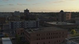 5.7K aerial stock footage stationary view of apartment buildings, approach the Old Courthouse Museum at sunset in Downtown Sioux Falls, South Dakota Aerial Stock Footage | DX0002_176_024
