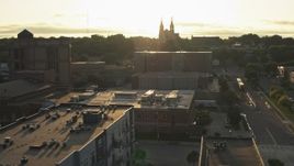 5.7K aerial stock footage orbit county office buildings, cathedral in background at sunset in Downtown Sioux Falls, South Dakota Aerial Stock Footage | DX0002_176_028