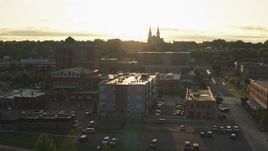 5.7K aerial stock footage flyby apartment, county office buildings, cathedral at sunset in Downtown Sioux Falls, South Dakota Aerial Stock Footage | DX0002_176_029