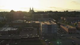 5.7K aerial stock footage pass by apartment, county office buildings, cathedral at sunset in Downtown Sioux Falls, South Dakota Aerial Stock Footage | DX0002_176_030