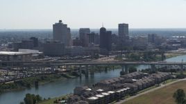 5.7K aerial stock footage ascending from apartment buildings with view of the city's skyline and bridge in Downtown Memphis, Tennessee Aerial Stock Footage | DX0002_177_007