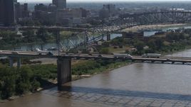 5.7K aerial stock footage of cars and trucks crossing the bridge spanning the Mississippi River, Memphis, Tennessee Aerial Stock Footage | DX0002_177_017