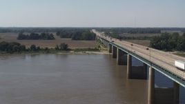 5.7K aerial stock footage following the bridge over the Mississippi River toward Arkansas farmland Aerial Stock Footage | DX0002_177_024