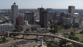 5.7K aerial stock footage of flying toward office towers in the Downtown Memphis, Tennessee skyline Aerial Stock Footage | DX0002_178_009
