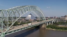 5.7K aerial stock footage flying by cars crossing the bridge to Memphis, Tennessee, reveal Memphis Pyramid Aerial Stock Footage | DX0002_178_022