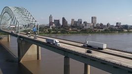5.7K aerial stock footage flyby bridge traffic with a view of the skyline of Downtown Memphis, Tennessee Aerial Stock Footage | DX0002_178_033