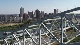 5.7K aerial stock footage ascend past bridge for a view of the skyline of Downtown Memphis, Tennessee Aerial Stock Footage | DX0002_178_035