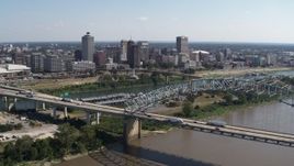 5.7K aerial stock footage fly away from river to reveal bridge while focused on the skyline of Downtown Memphis, Tennessee Aerial Stock Footage | DX0002_178_041